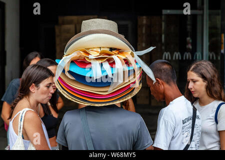 A Man Sells Hats On White Beach, Boracay, Aklan Province, The Philippines Stock Photo