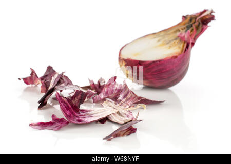 One half lot of pieces of stale red onion isolated on white background Stock Photo