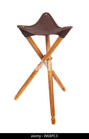 Folding wooden hunting stool tripod isolate on white background. Three-legged camping chair, Made of wood and leather. Stock Photo