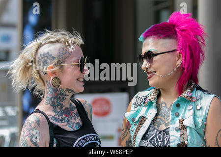 Female punks with dyed hair in Blackpool, Lancashire, UK. 31st July, 2019.  Bobbie from Texas a Rock Band member at the Rebellion Festival world's largest punk festival in Blackpool. At the beginning of August, Blackpool’s Winter Gardens plays host to a massive line up of punk bands for the 21st edition of Rebellion Festival attracting thousands of tourists to the resort.  Over 4 days every August in Blackpool, the very best in Punk gather for this social event of the year with 4 days of music across 6 stages with masses of bands. Credit; MediaWorldImages/Alamy Live News Stock Photo