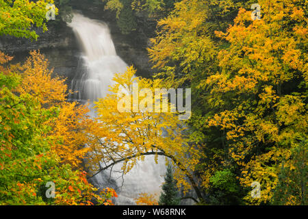 Autumn color surrounds Chapel Falls in Pictured Rocks National Lakeshore and Michigan’s Upper Peninsula. Stock Photo