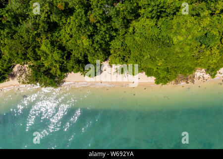 Aerial drone view of a beautiful tropical sandy beach surrounded by lush forest (Koh Yao Noi, Thailand) Stock Photo
