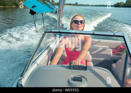 Pleased sporty blonde girl in a tank top Stock Photo