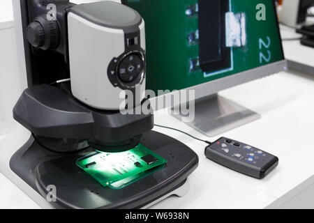 Technical inspection workstation with a digital microscope for advanced inspection of printed circuit boards (PCB). Selective focus. Stock Photo