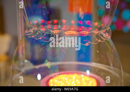 Soap bubbles show. Children's party. To burst the soap bubble Stock Photo