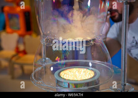 Soap bubbles show. Children's party. To burst the soap bubble Stock Photo