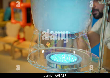 Soap bubbles show. Children's party. To burst the soap bubble Stock Photo