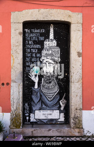 Wall painting street art mural by Altura in Cascais, Portugal showing a man from the 1979 novel "If on a Winter's Night a Traveler" by Italo Calvino. Stock Photo
