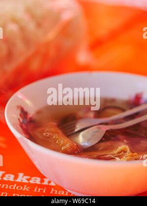 Timlo sastro served to buyer. Timlo is a soup, containing slices of chicken liver ati, sliced omelette rolls, sliced  Stock Photo