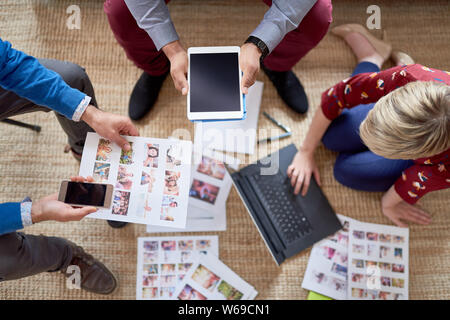 Multi-ethnic team of creative millenials collaborating on a brainstorm project Stock Photo