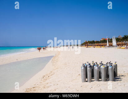 Playa del Carmen, Mexico - March 23, 2010: Several scuba diving tanks stacked on the beach to be used by a group of tourists who are going to dive in Stock Photo