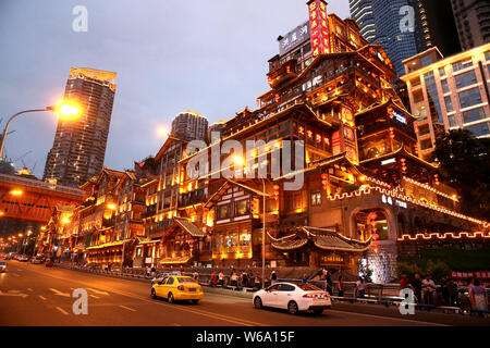 Night view of the illuminated Hongyadong settled house complex in Jiangbei district, Chongqing, China, 8 June 2018.    Hongyadong is located within 50 Stock Photo