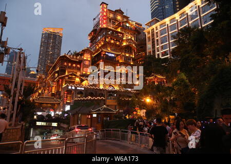 Night view of the illuminated Hongyadong settled house complex in Jiangbei district, Chongqing, China, 8 June 2018.    Hongyadong is located within 50 Stock Photo