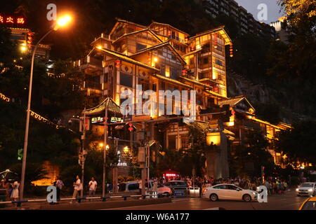 Night view of the illuminated Hongyadong settled house complex in Jiangbei district, Chongqing, China, 8 June 2018.    Hongyadong is located within 50 Stock Photo