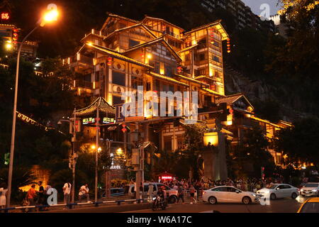 Night view of the illuminated Hongyadong settled house complex in Jiangbei district, Chongqing, China, 8 June 2018.    Hongyadong is located within 50 Stock Photo