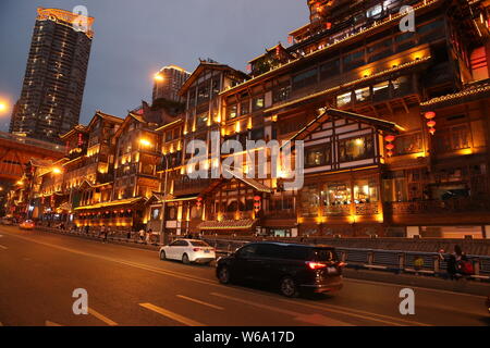 Night view of the illuminated Hongyadong settled house complex in Jiangbei district, Chongqing, China, 8 June 2018.    Hongyadong is located within 50 Stock Photo