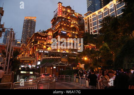 Night view of the illuminated Hongyadong settled house complex in Jiangbei district, Chongqing, China, 8 June 2018.    Hongyadong is located within 50 Stock Photo