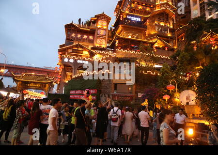 Night view of the illuminated Hongyadong settled house complex in Jiangbei district, Chongqing, China, 8 June 2018.    Hongyadong is located within 50 Stock Photo