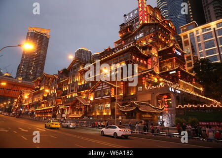 Night view of the illuminated Hongyadong settled house complex in Jiangbei district, Chongqing, China, 8 June 2018.    Hongyadong is located within 50 Stock Photo