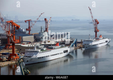 China's first domestically built aircraft carrier, the Type 001A, is pictured in the dry dock as China's first aircraft carrier, back, the Liaoning, a Stock Photo