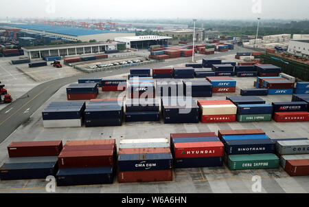 Cargo containers shipped by freight trains of the China-Europe Railway Express are stacked at the Chengdu Railway Port Multimodal Transport Customs Su Stock Photo