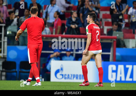 Antonio Rukavina of Serbia, right, who lost his shorts walks towards the sideline after their Group E match against Brazil during the FIFA World Cup 2 Stock Photo