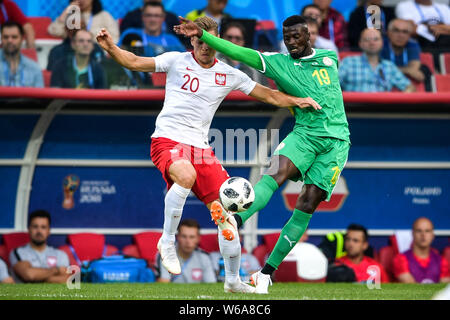 M'Baye Niang of Senegal, right, challenges Lukasz Piszczek of Poland in their Group H match during the FIFA World Cup 2018 in Moscow, Russia, 19 June Stock Photo