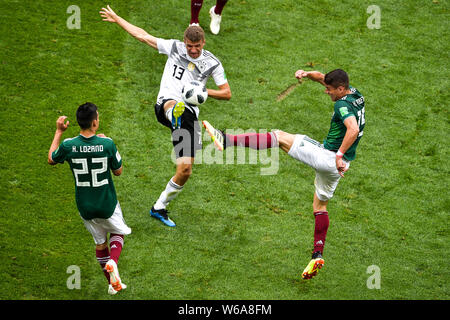 Hector Moreno of Mexico, right, challenges Thomas Muller (Mueller) of Germany in their Group F match during the 2018 FIFA World Cup in Moscow, Russia, Stock Photo