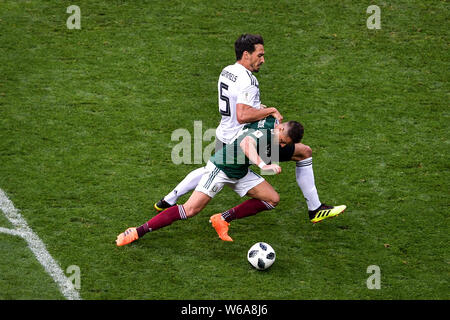 Javier Hernandez of Mexico, left, challenges Mats Hummels of Germany in their Group F match during the 2018 FIFA World Cup in Moscow, Russia, 17 June Stock Photo