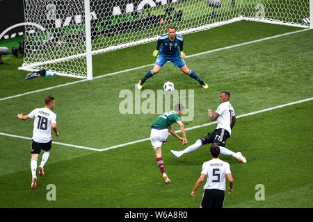 Hirving Lozano of Mexico, center, shoots against Germany in their Group F match during the FIFA World Cup 2018 in Moscow, Russia, 17 June 2018. Stock Photo