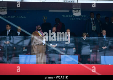 (From third left) Crown Prince of Saudi Arabia, FIFA president Gianni Infantino and Russian President Vladimir Putin watch the Group A match between R Stock Photo