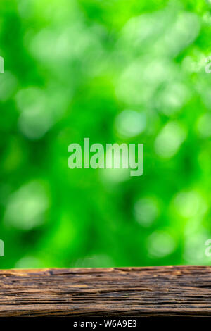 Empty wooden table over blur green background, fresh natural scene with  copyscape Stock Photo - Alamy