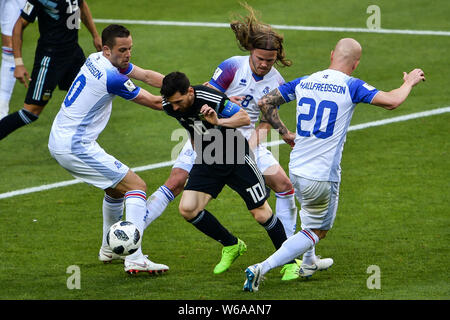 Lionel Messi of Argentina, center, challenges (from left) Gylfi Sigurdsson, Birkir Bjarnason and Emil Hallfredsson of Iceland in their Group D match d Stock Photo