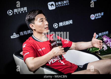 **EXCLUSIVE**Chinese retired football player Li Weifeng prepares for the official portrait filming session of the 2018 Super Penguin Soccer Celebrity Stock Photo