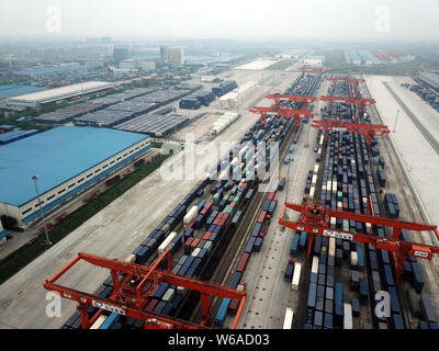 Cargo containers shipped by freight trains of the China-Europe Railway Express are stacked at the Chengdu Railway Port Multimodal Transport Customs Su Stock Photo