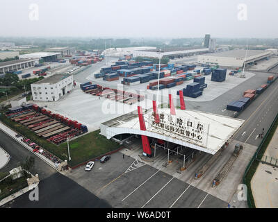 Cargo containers shipped by freight trains of the China-Europe Railway Express are stacked at the Chengdu Railway Port Multimodal Transport Customs Su Stock Photo