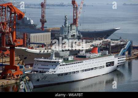 China's first domestically built aircraft carrier, the Type 001A, is pictured in the dry dock as China's first aircraft carrier, back, the Liaoning, a Stock Photo