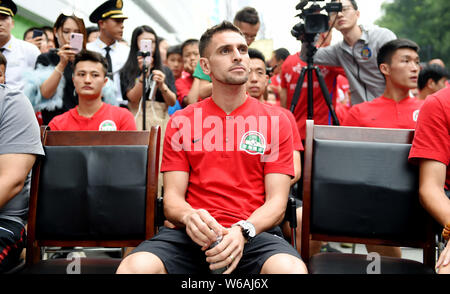 Brazilian football player Olivio da Rosa, also known as Ivo, attends a fan meeting event in Luoyang city, central China's Henan province, 17 June 2018