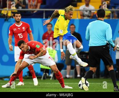 Neymar of Brazil, right, challenges Granit Xhaka of Switzerland in their Group E match during the 2018 FIFA World Cup in Rostov, Russia, 17 June 2018. Stock Photo