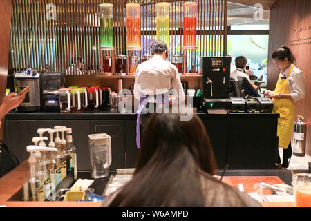 Interior view of Hong Kong's largest Starbucks flagship store at Causeway Bay in Hong Kong, China, 22 June 2018.   Starbucks opened its new flagship s Stock Photo