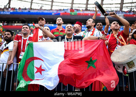 Fans wave flags and shout slogans to show their support for Morocco before the Group B match between Morocco and Portugal during the 2018 FIFA World C Stock Photo