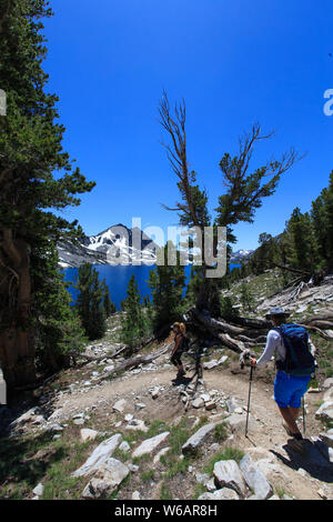 Mammoth Lakes, CA—July 30, 2019. Two women hike on the Duck Lake trail to Duck Lake at 10,482 feet of elevation near Mammoth Lakes, CA. Stock Photo