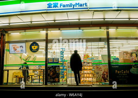 --FILE--A customer walks into a Family Mart convenience store in Shanghai, China, 4 September 2018.   Japan's convenience stores are aggressively pene Stock Photo