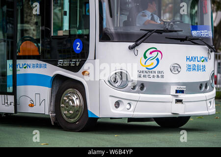 An Alphabus smart bus with self-driving bus technology is pictured at a base in Shenzhen city, south China's Guangdong province, 9 May 2018.   The sel Stock Photo