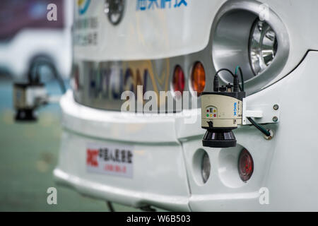 An Alphabus smart bus with self-driving bus technology is pictured at a base in Shenzhen city, south China's Guangdong province, 9 May 2018.   The sel Stock Photo