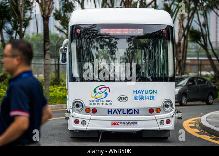 An Alphabus smart bus with self-driving bus technology is pictured at a base in Shenzhen city, south China's Guangdong province, 9 May 2018.   The sel Stock Photo