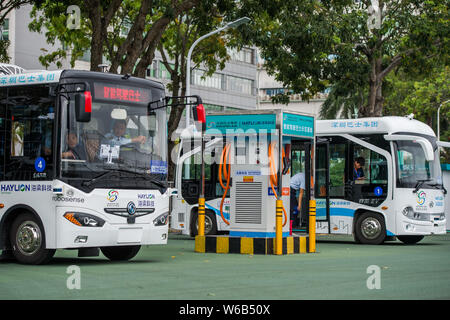 Alphabus smart buses with self-driving bus technology are pictured at a base in Shenzhen city, south China's Guangdong province, 9 May 2018.   The sel Stock Photo