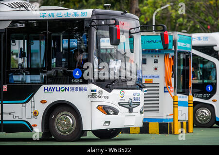 Alphabus smart buses with self-driving bus technology are pictured at a base in Shenzhen city, south China's Guangdong province, 9 May 2018.   The sel Stock Photo