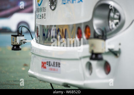 An Alphabus smart bus with self-driving bus technology is pictured at a base in Shenzhen city, south China's Guangdong province, 9 May 2018.   The sel Stock Photo