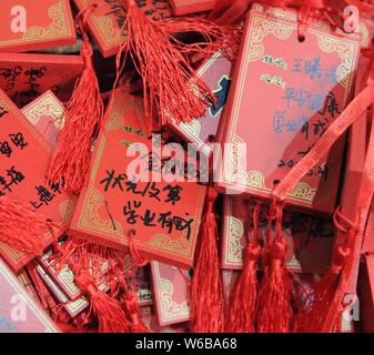 Blessings written by Chinese parents to prayer their children for good luck in the upcoming national college entrance exam, also known as gaokao, are Stock Photo